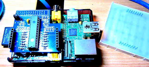 raspberry pi with PI Matrix board attached and the LED matrix upside to the right