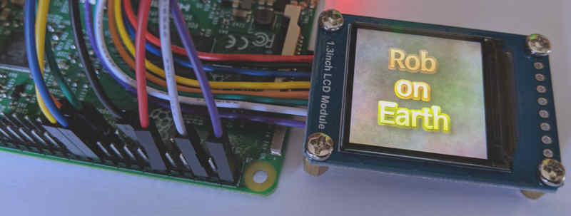 Photograph of a Waveshare 1.3inch LCD Module connected to a Raspberry Pi showing a custom image on the LCD
