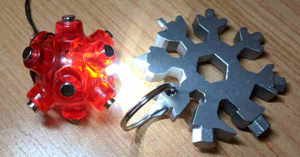 photograph of metal key-ring and lightmine